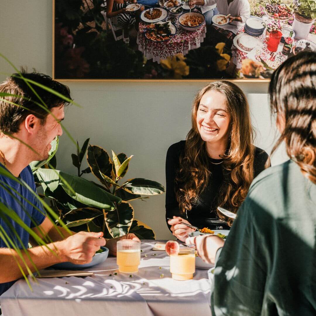 A small group of creatives meeting for lunch in their city